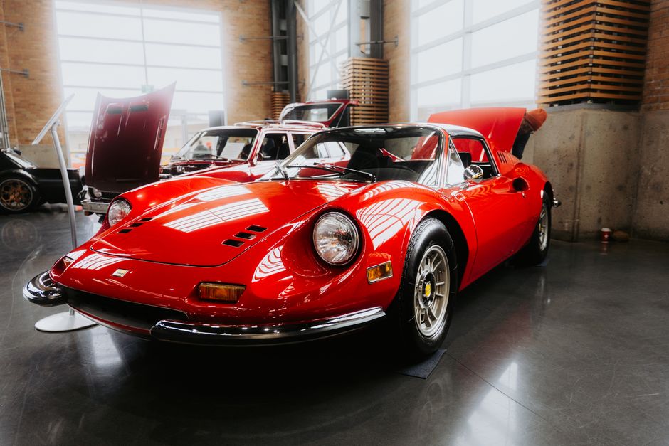 A gleaming, freshly detailed sports car showing off its mirror-like ceramic coating finish